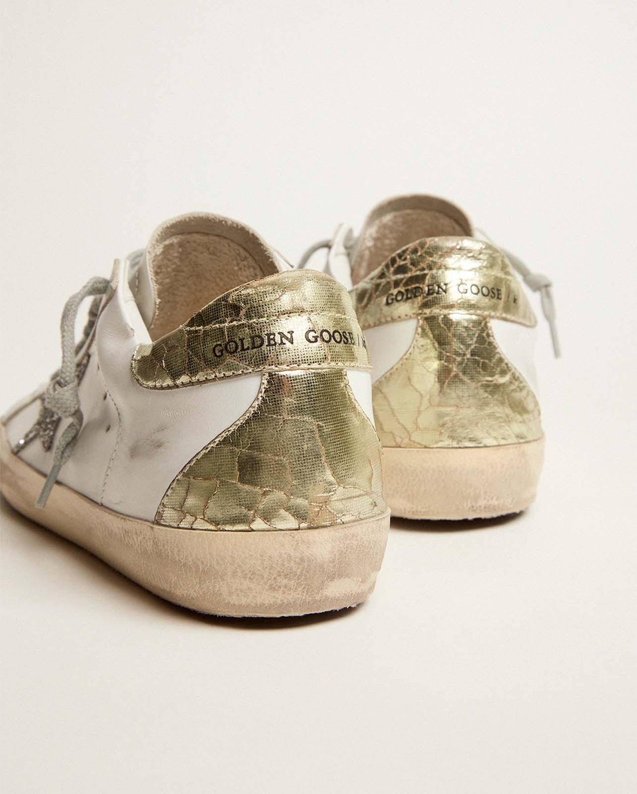 Close up photo of the back of a pair of Golden Goose sneakers