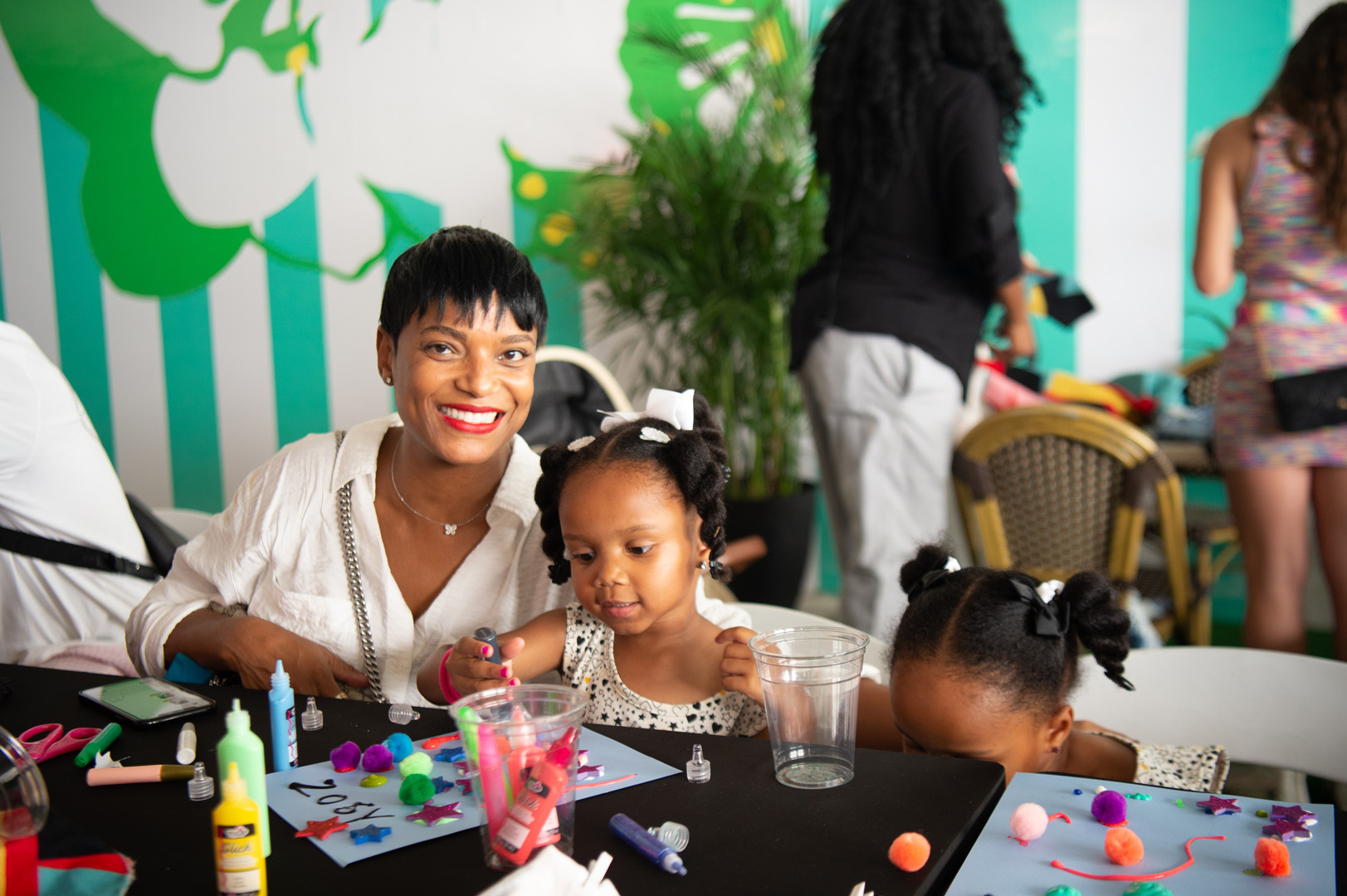 April McGlashan smiles with her two daughters