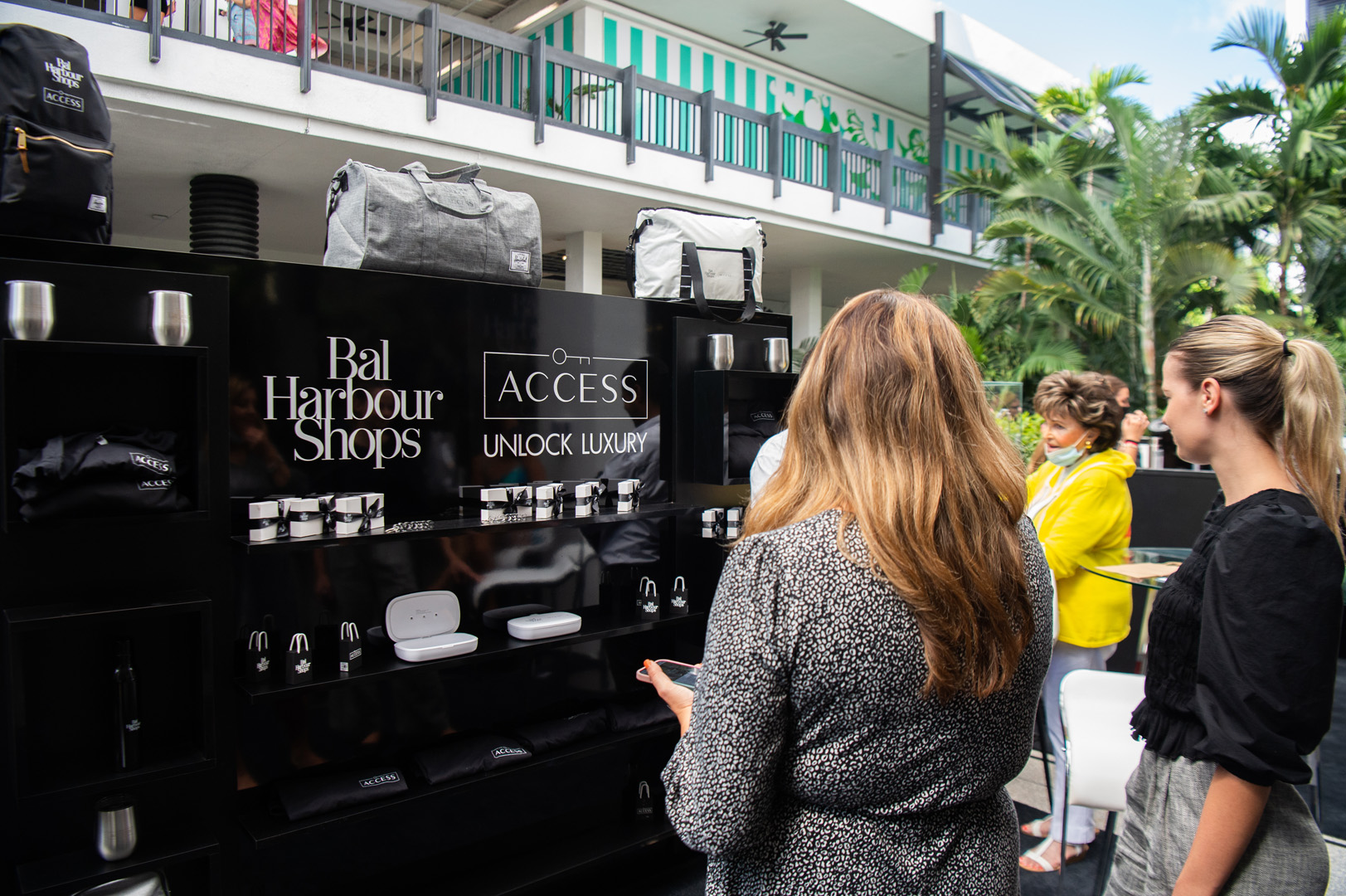 Woman photographed looking at ACCESS gift bags