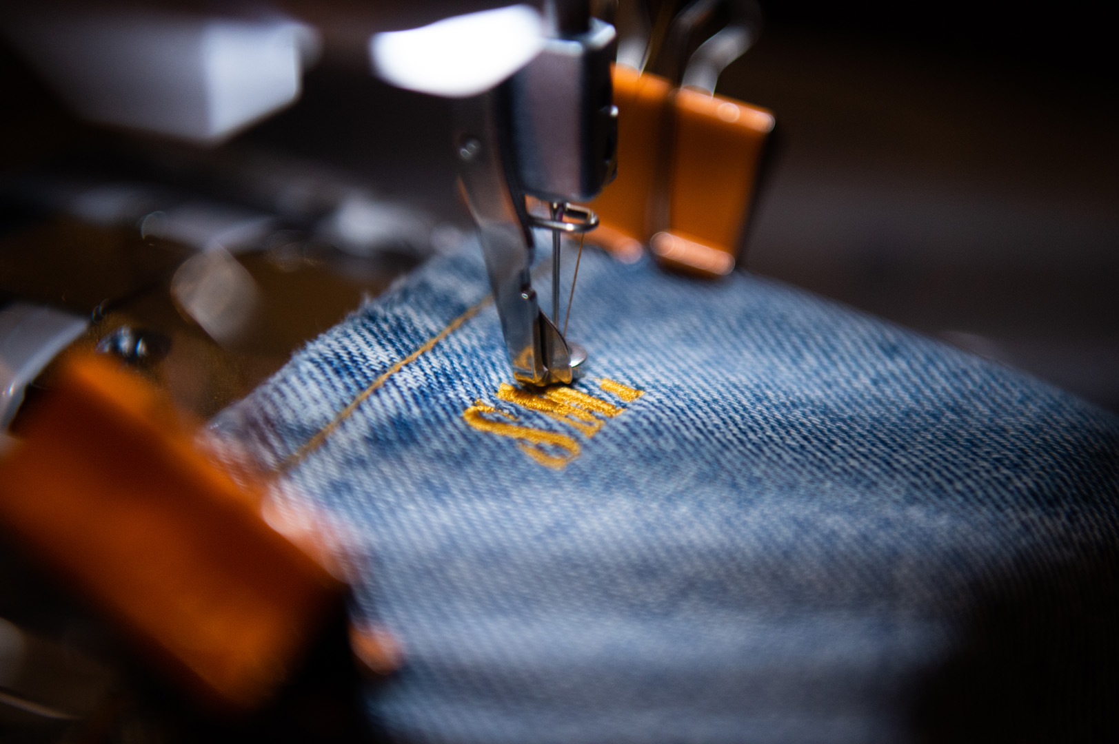 Stich embroidering a pair of jeans