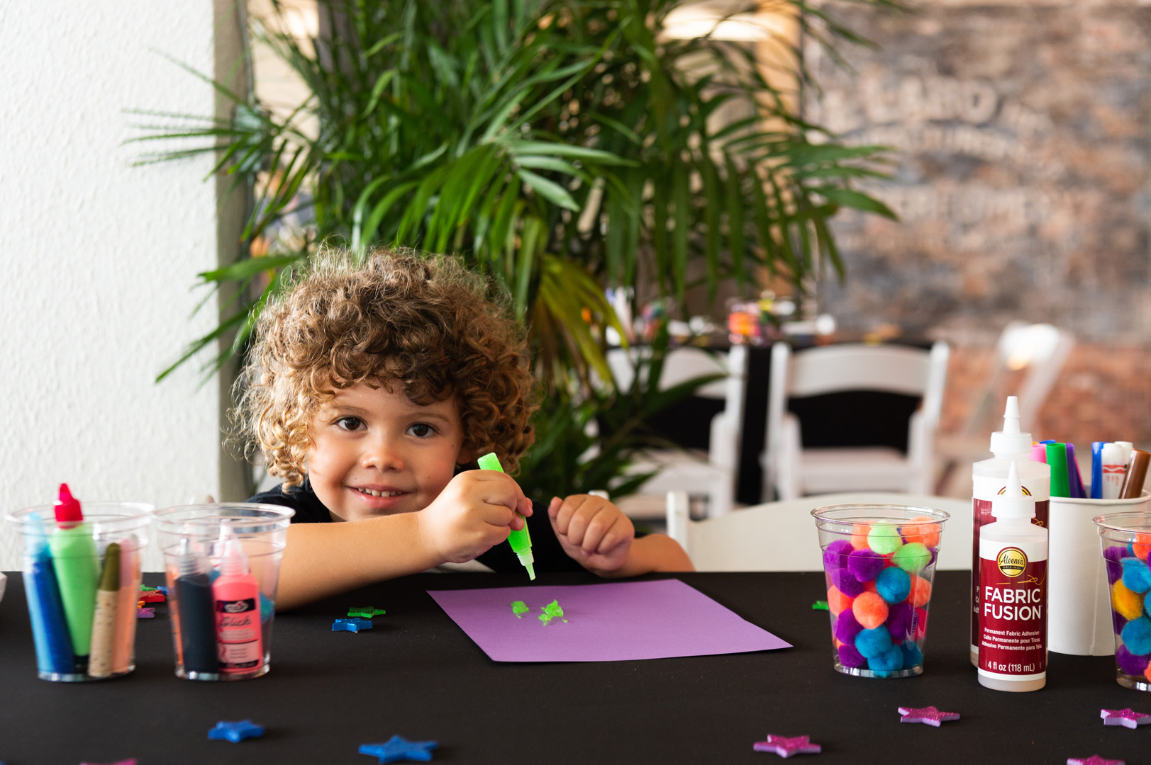 Young child plays with paint