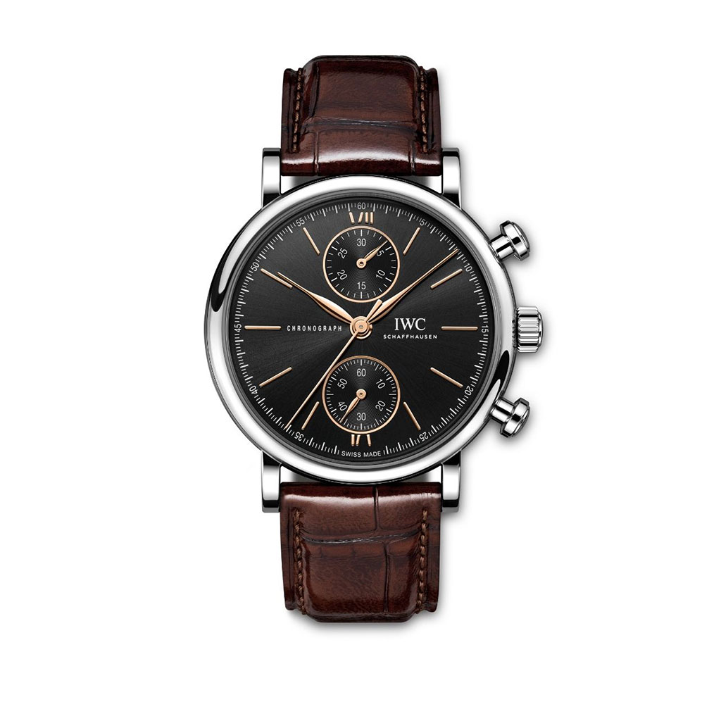 Watch with black face and brown leather strap