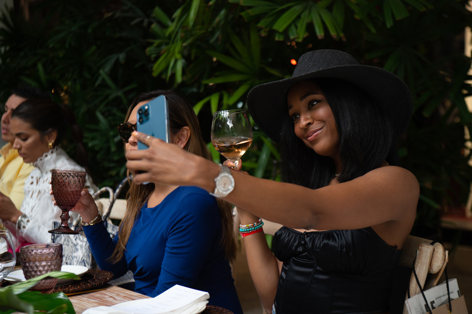 Ria Michelle taking a selfie with her rose