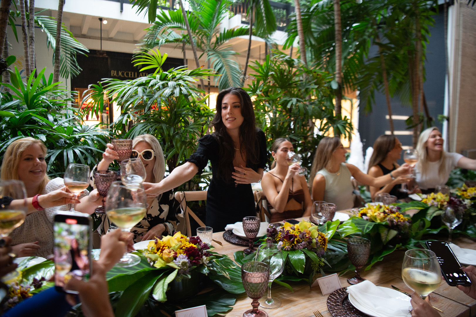 Shana Kaufman cheersing guests