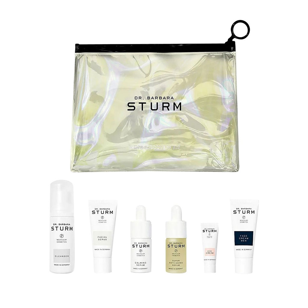Six Dr. Strum skincare products with iridescent carrying pouch.