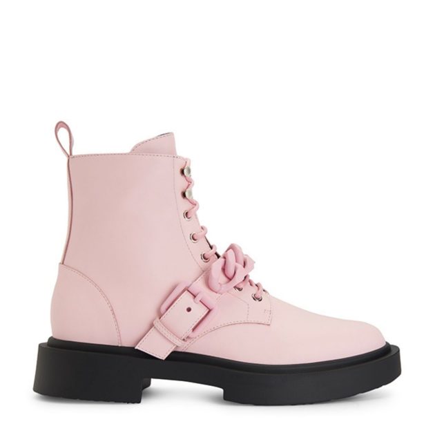 Pink boots with a black sole and chunk heel