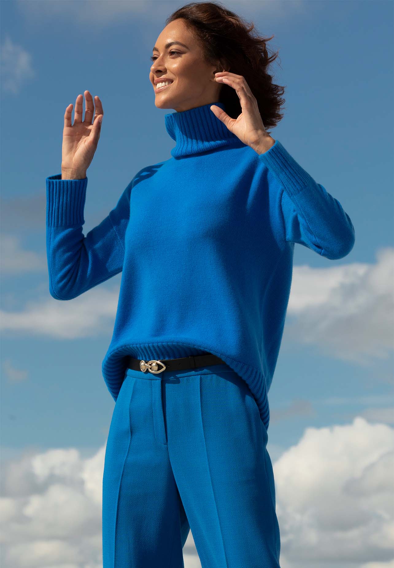 Model smiles in a blue Lafayette 148 New York look