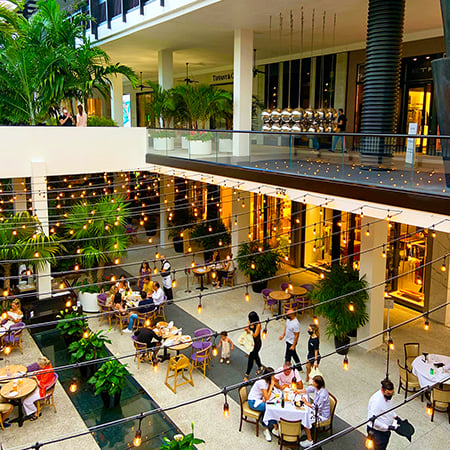 Bal Harbour Shops center courtyard scattered with dining tables