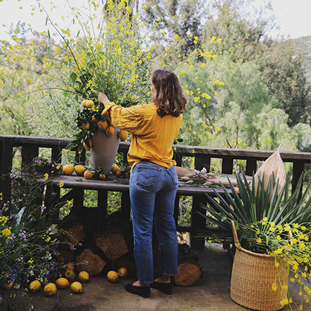 Woman tends to her lemon tree