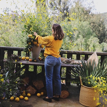 Woman tends to her lemon tree