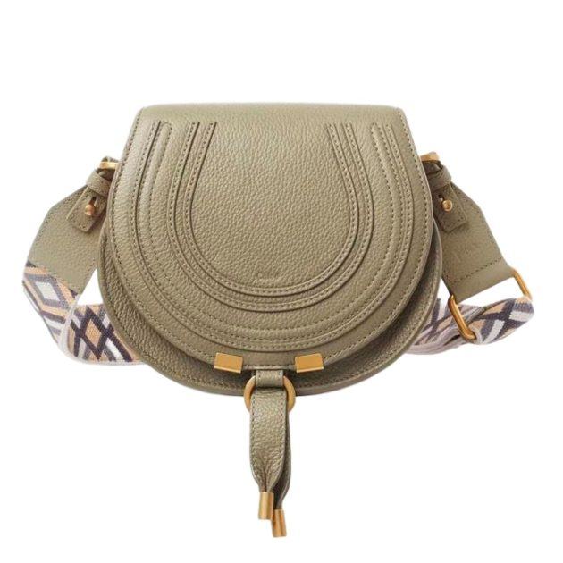green crossbody bag with aztec patterned strap
