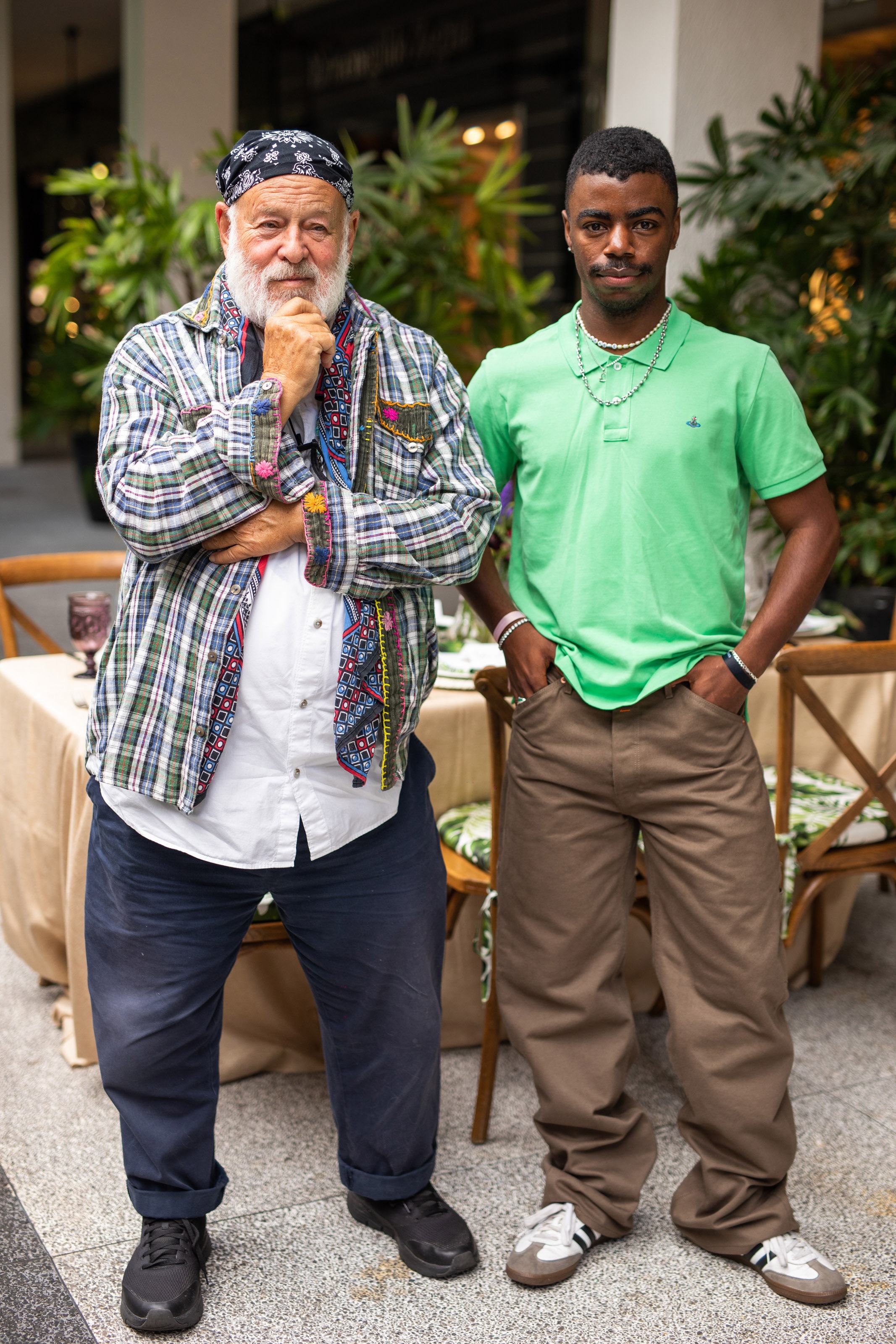 Bruce weber and Tyrell Hampton smile for a photo