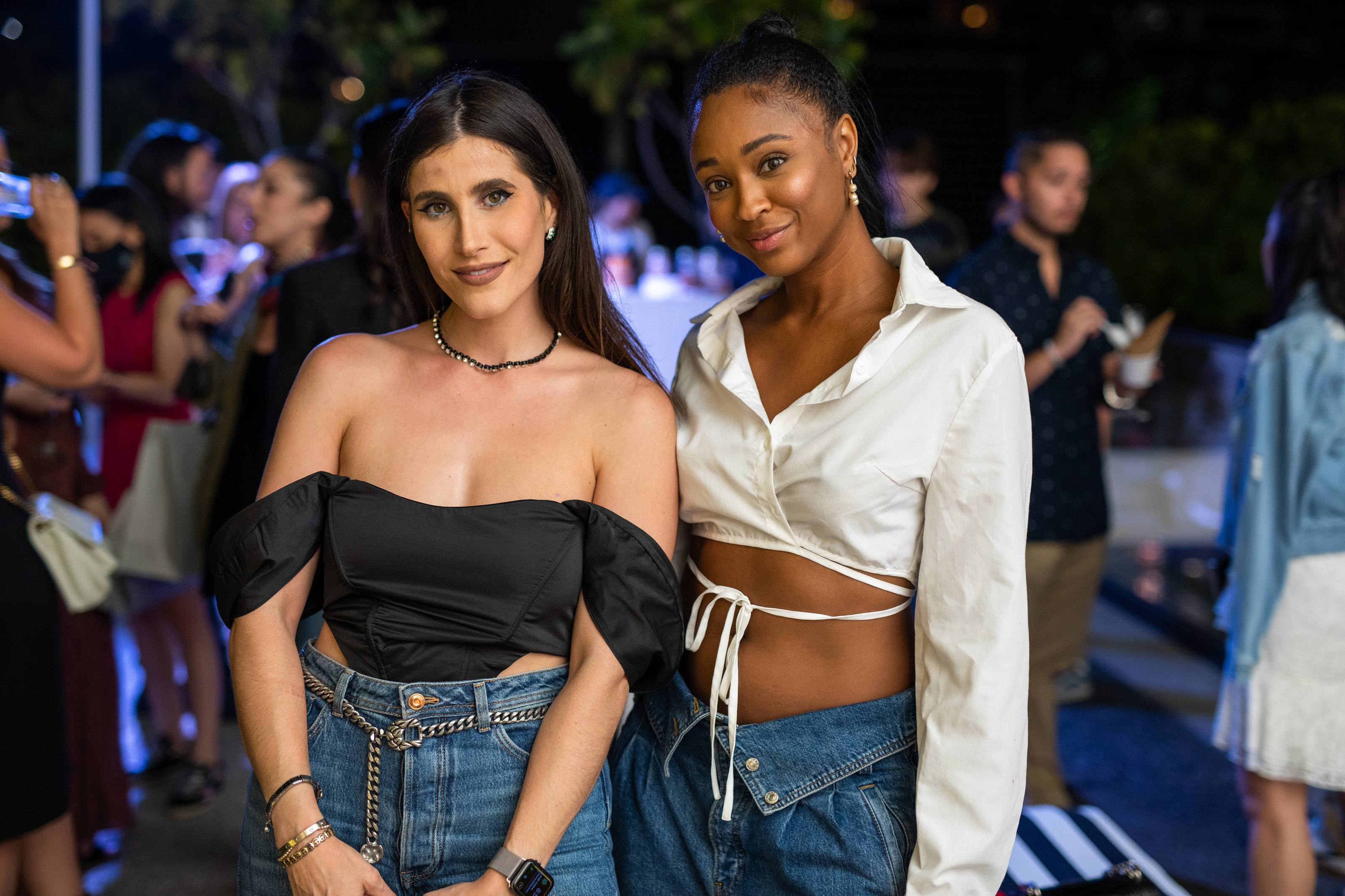 Two women smile for a photo