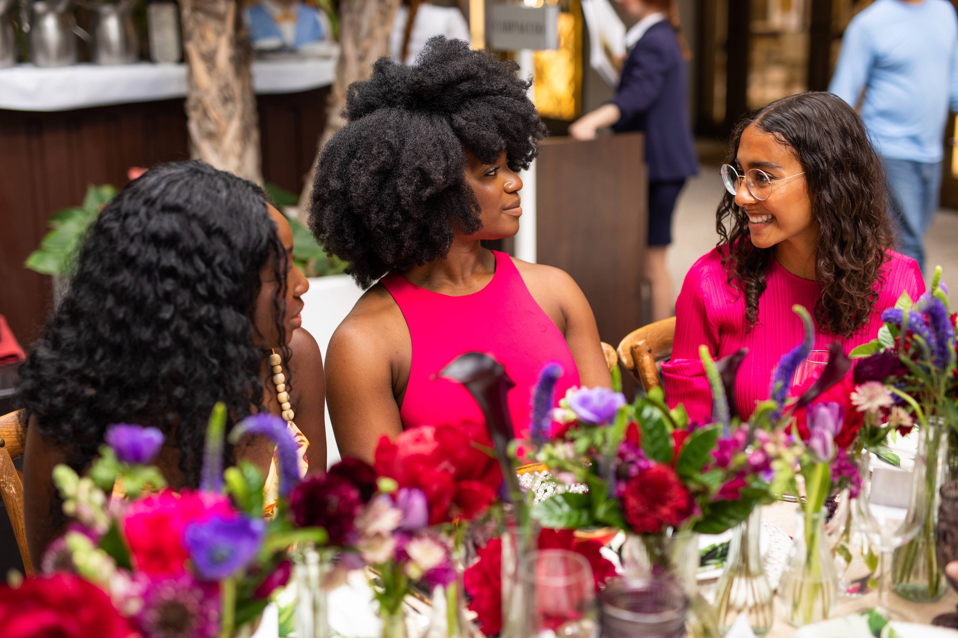 Three woman in conversation at the table