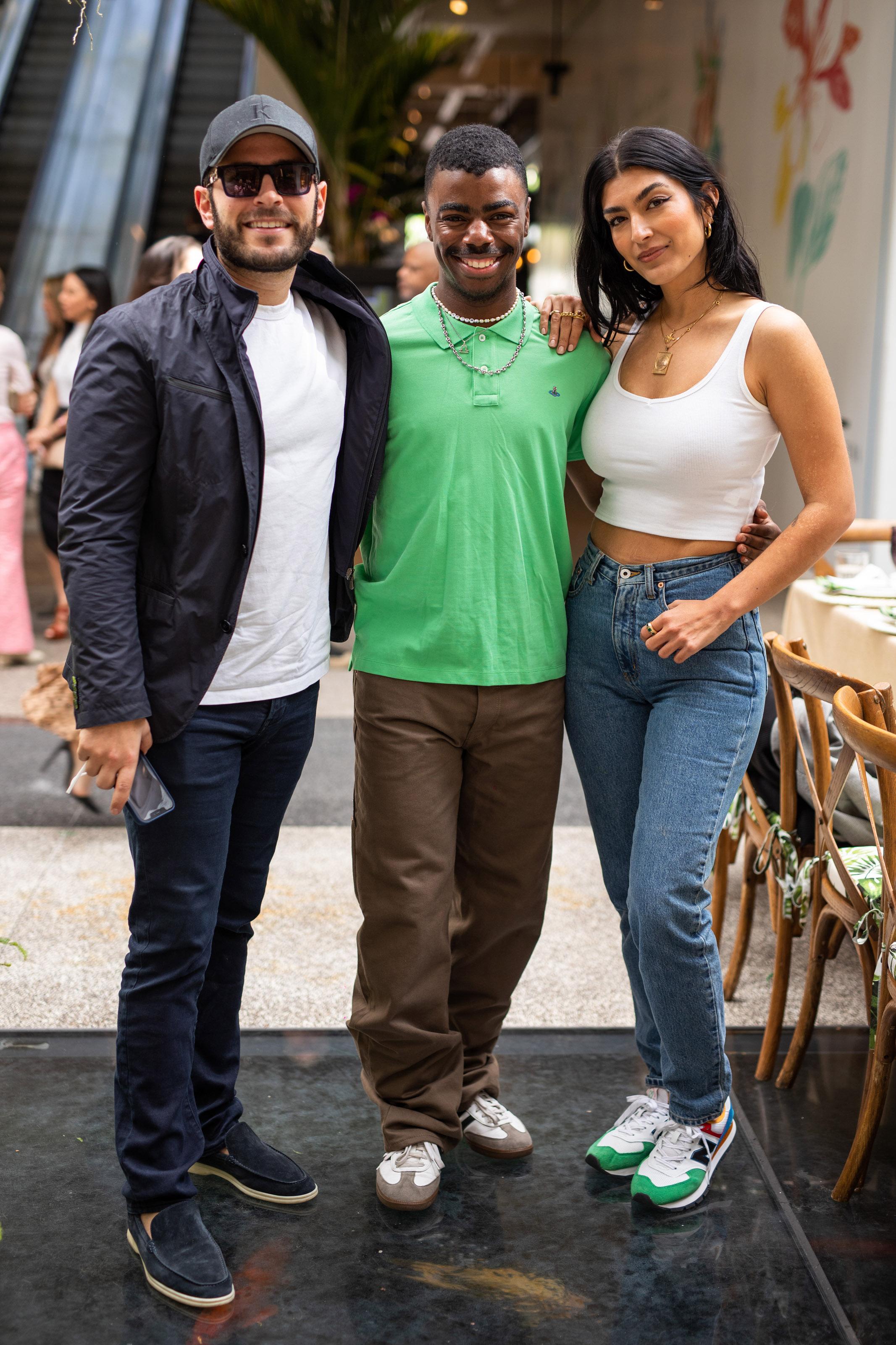 Tyrell Hampton poses for a photo with two other attendees
