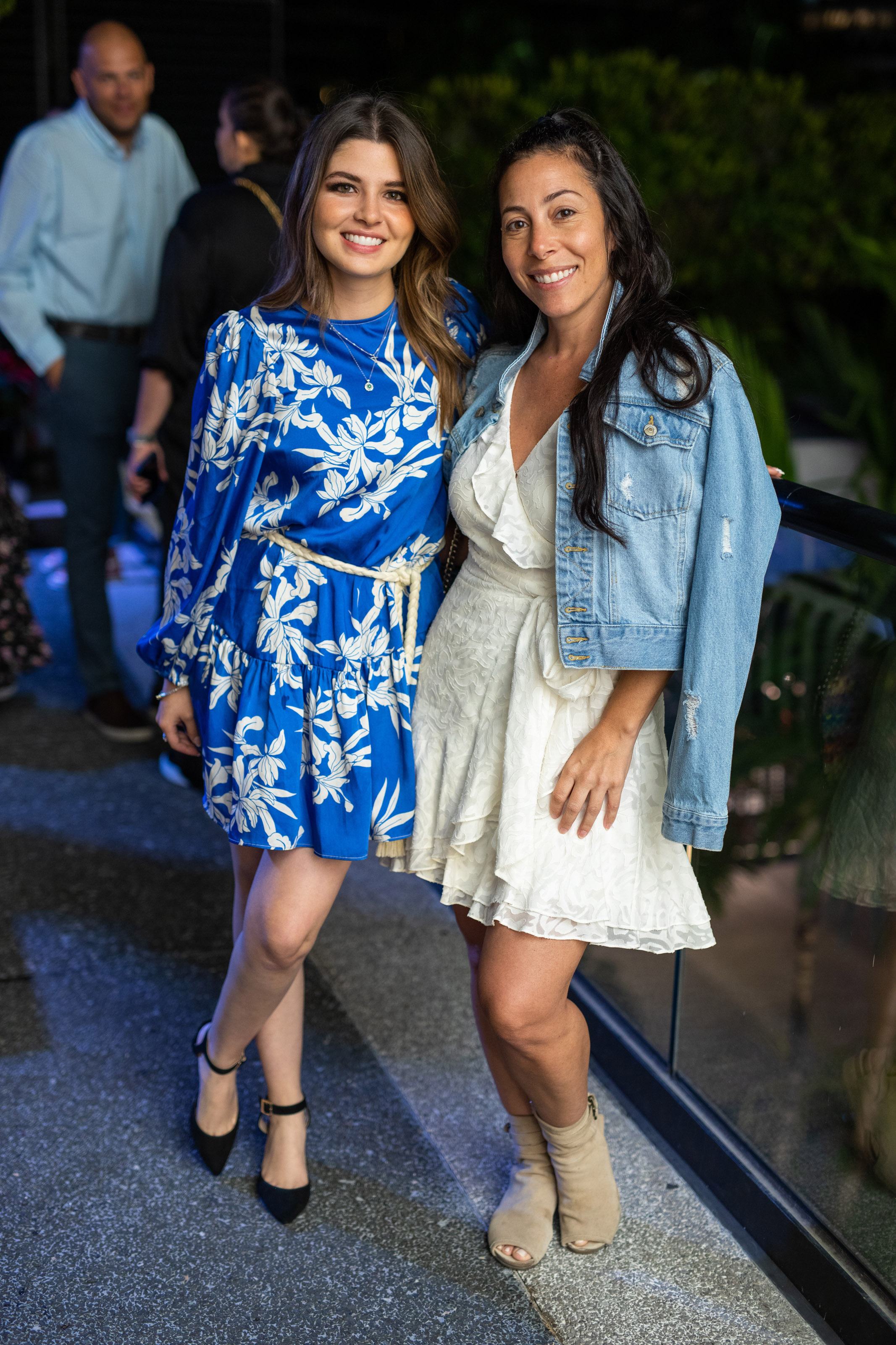 Two women smile for a photo together