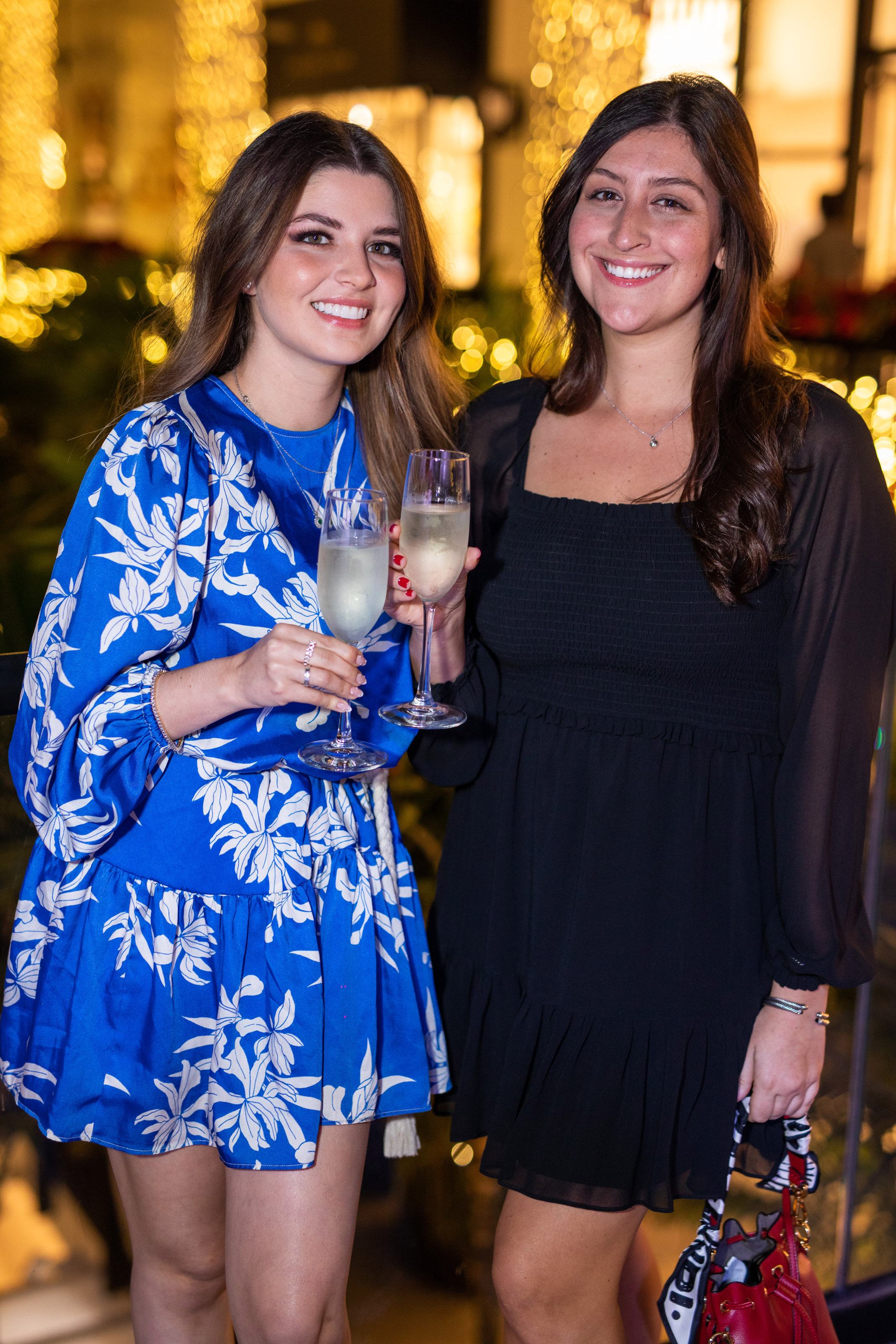 two women smile for a photo together