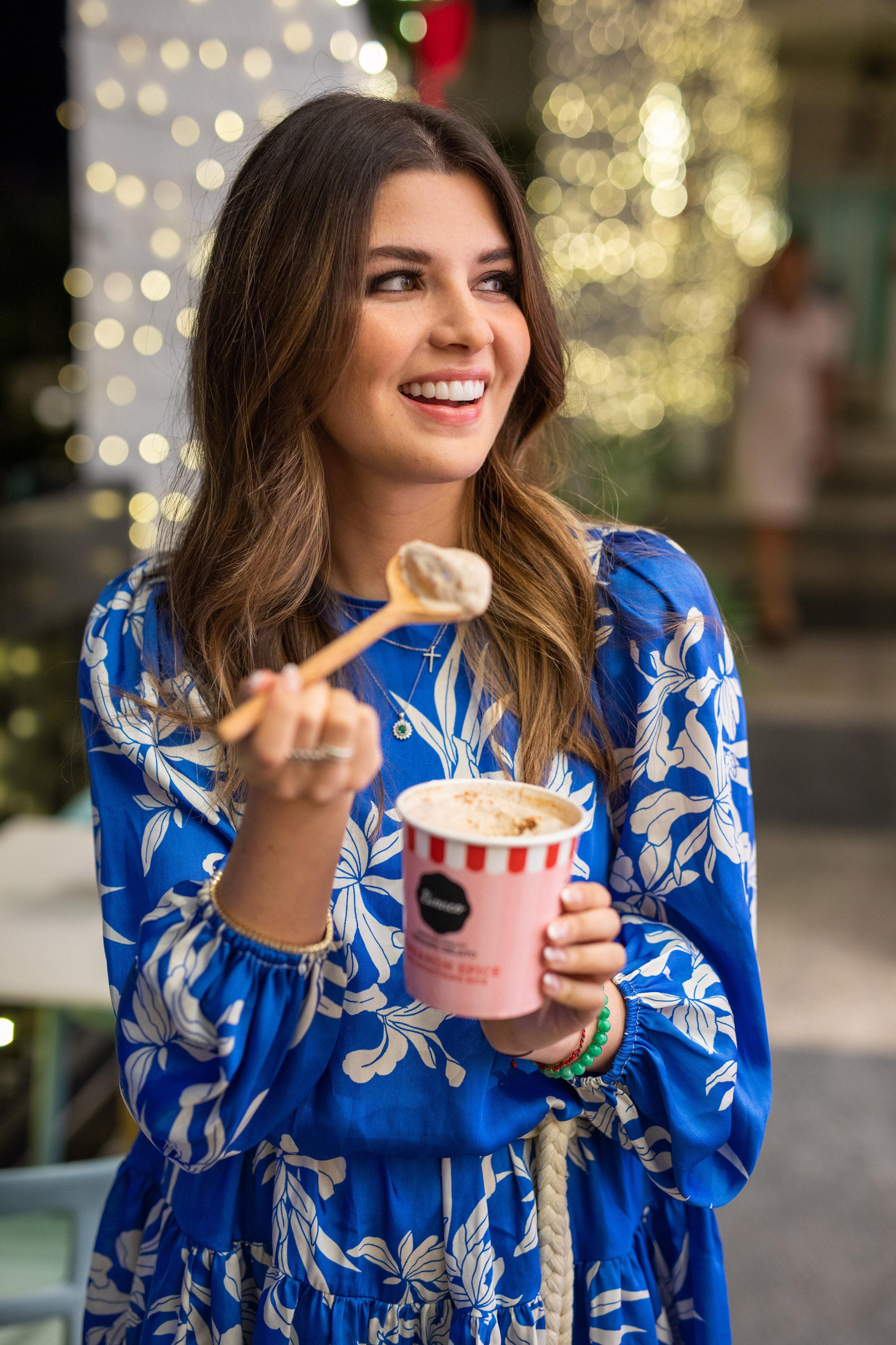 Valentina Mussi smiles for a photo with a spoonful of ice cream