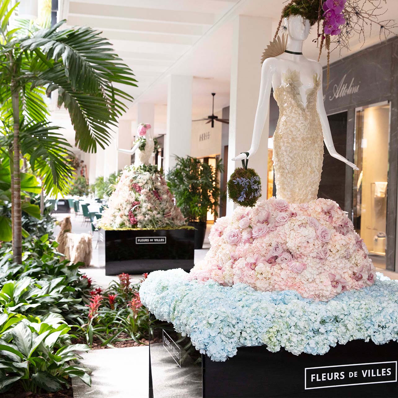 Mannequin decorated in light pink and blue flowers