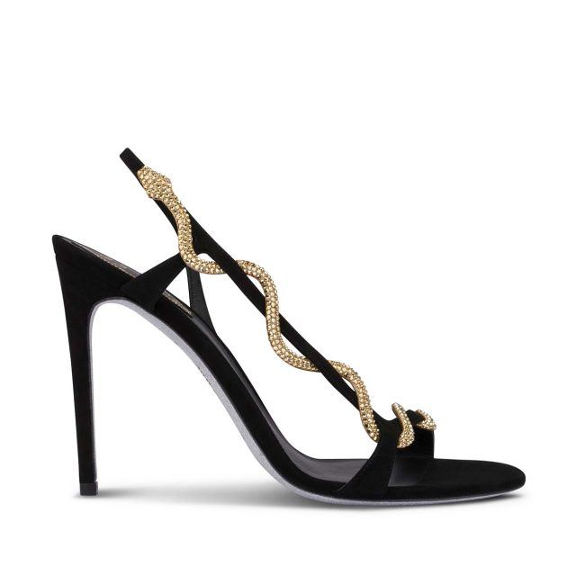 black sandal with gold snake detail on the foot