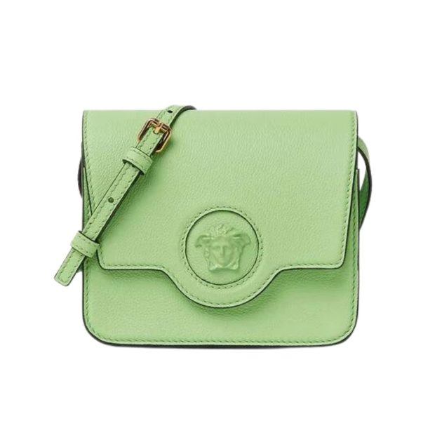 Pastel green cross body bag with medusa head detail