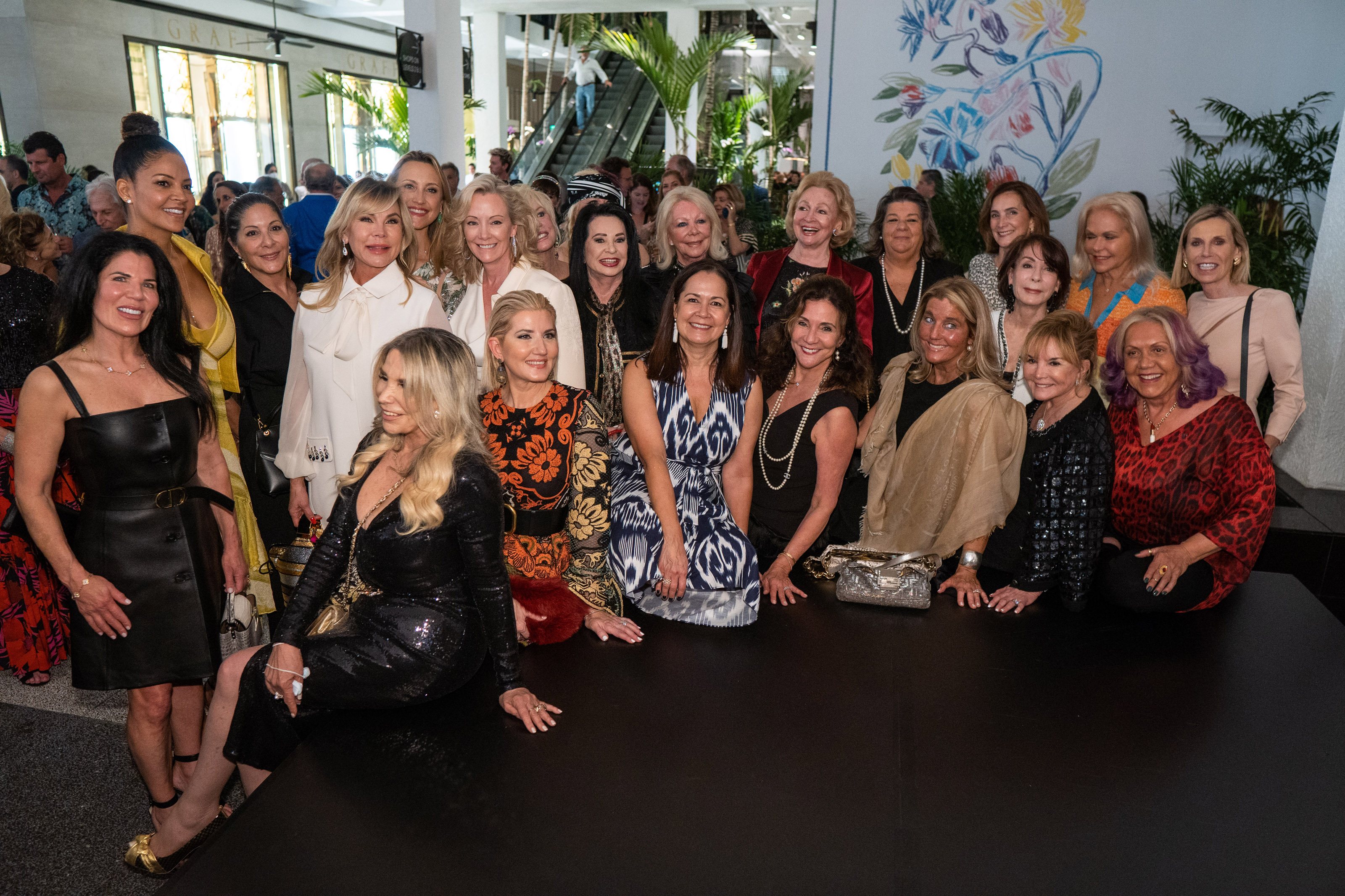 Group of women gather together for a photo