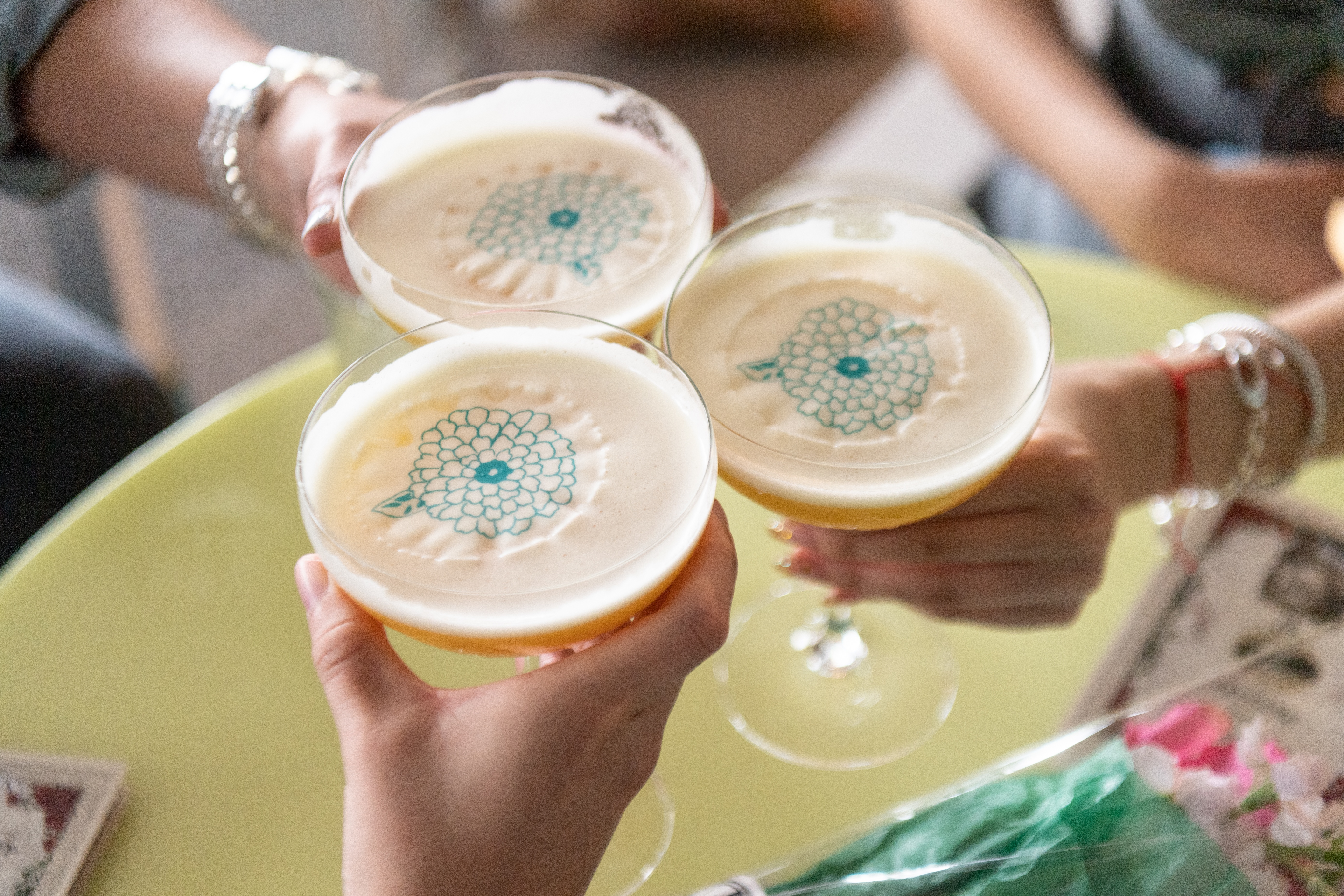 Three cocktails meeting for a “cheers”