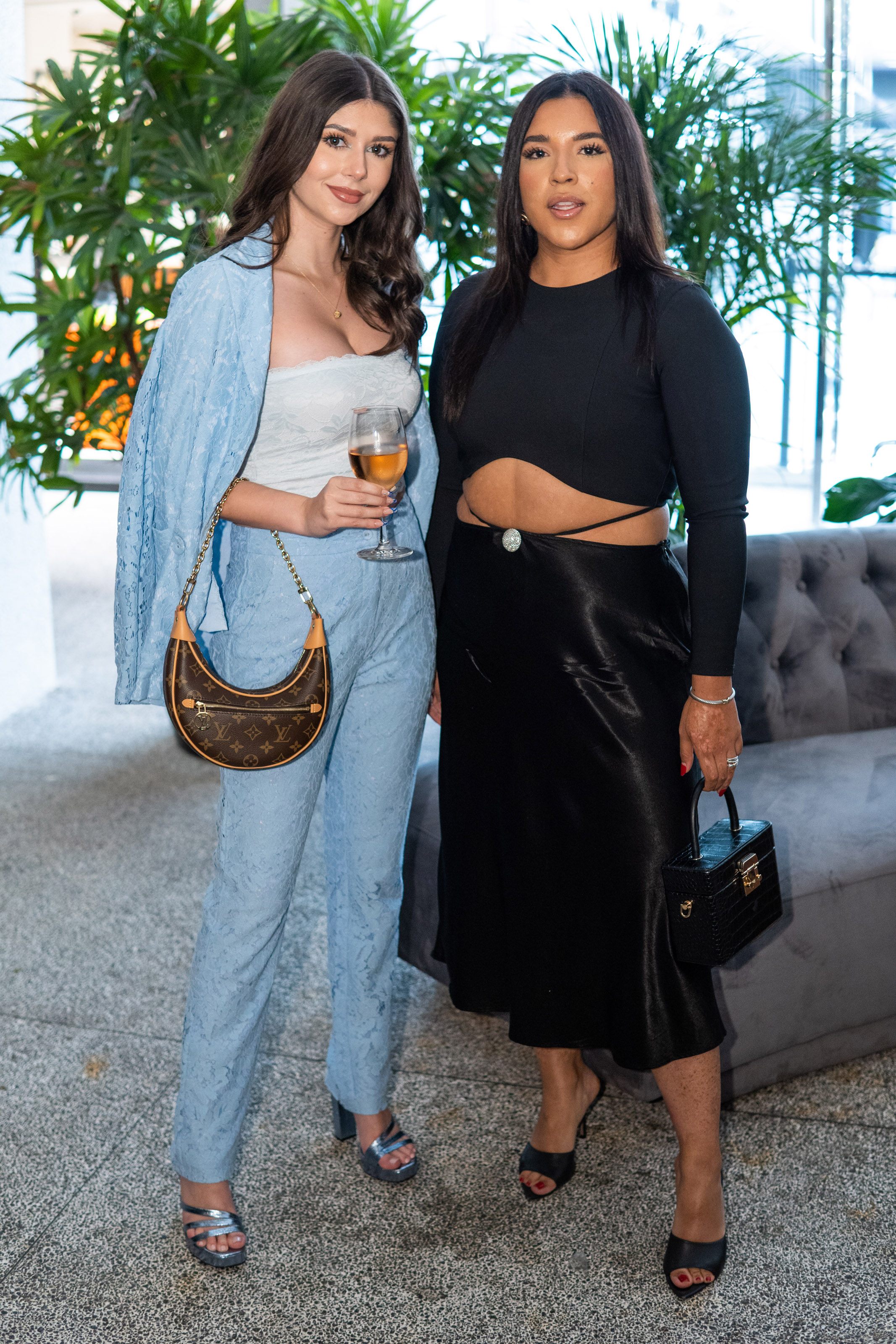 Two women smile for the camera