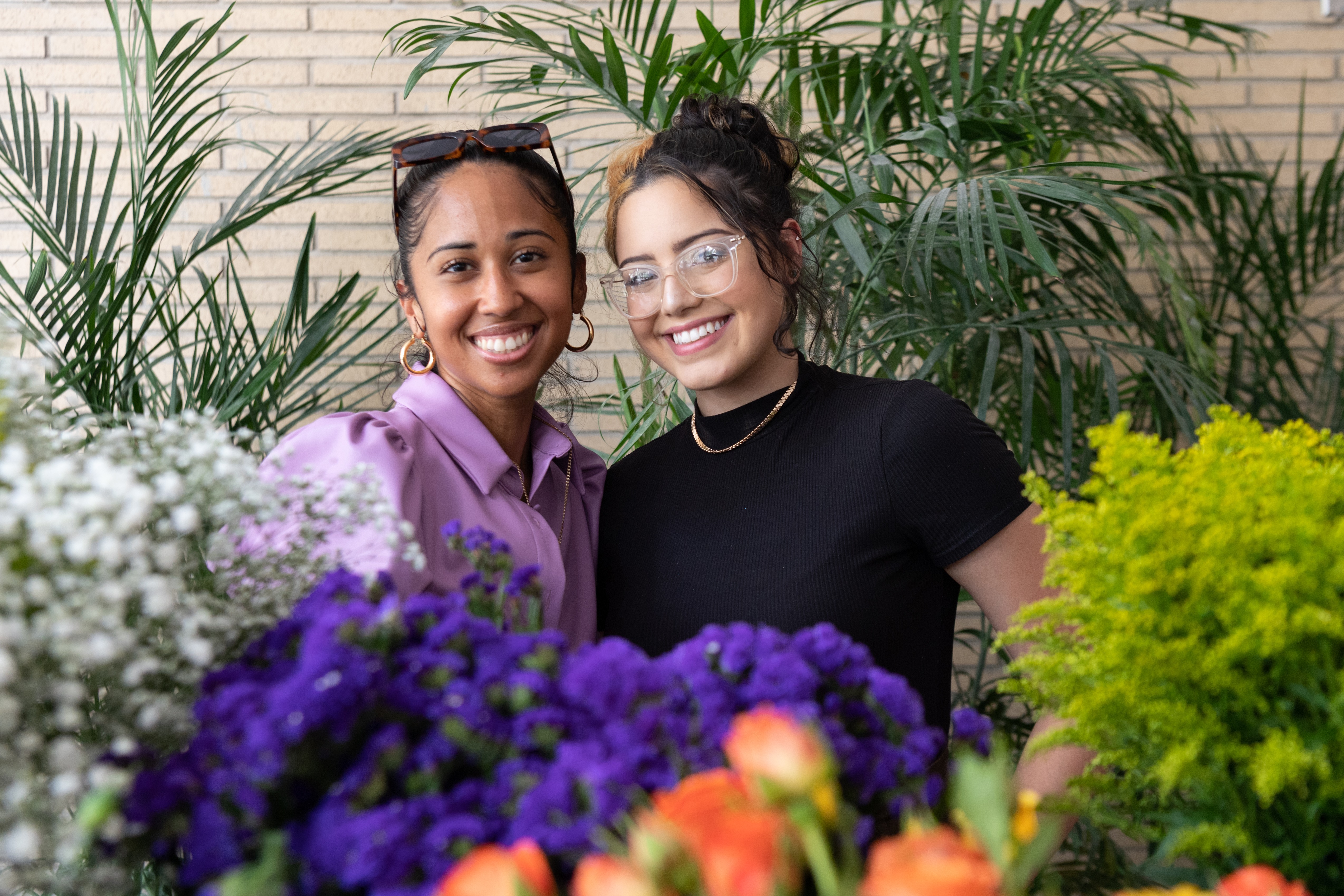 Two women smile for a photo together