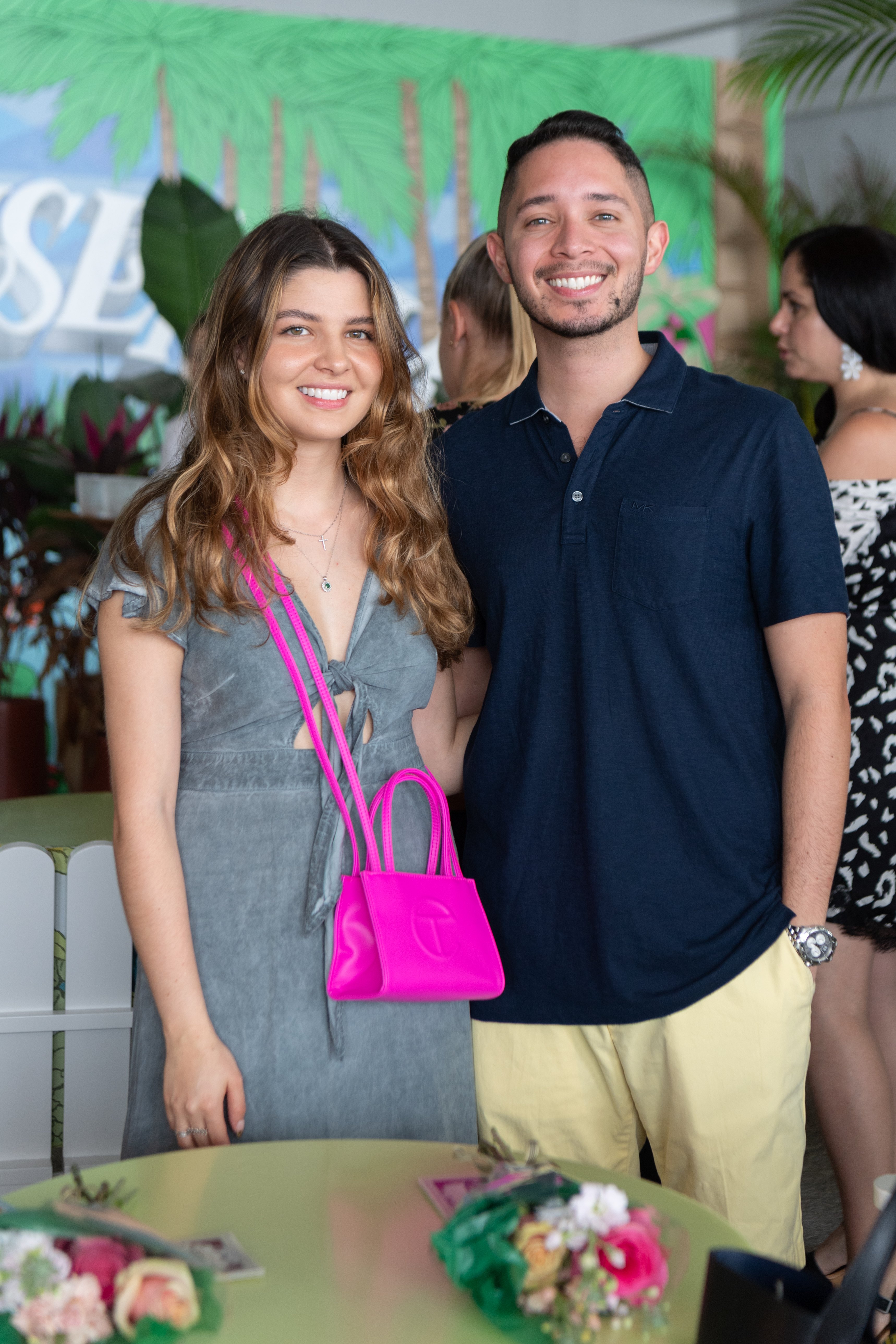 Young woman and man pose for a photo together