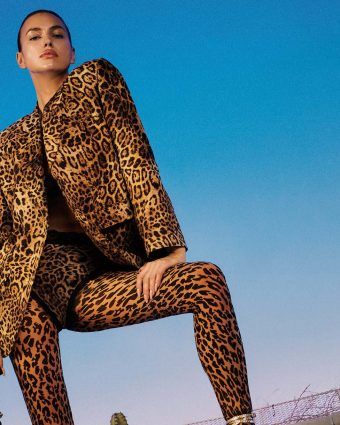 Irina Shayk featured in a Pinko campaign, wearing a leopard blazer and pants