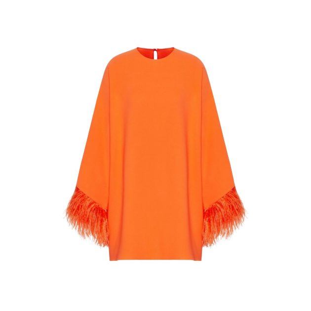 Orange caftan with feather trim on the sleeves
