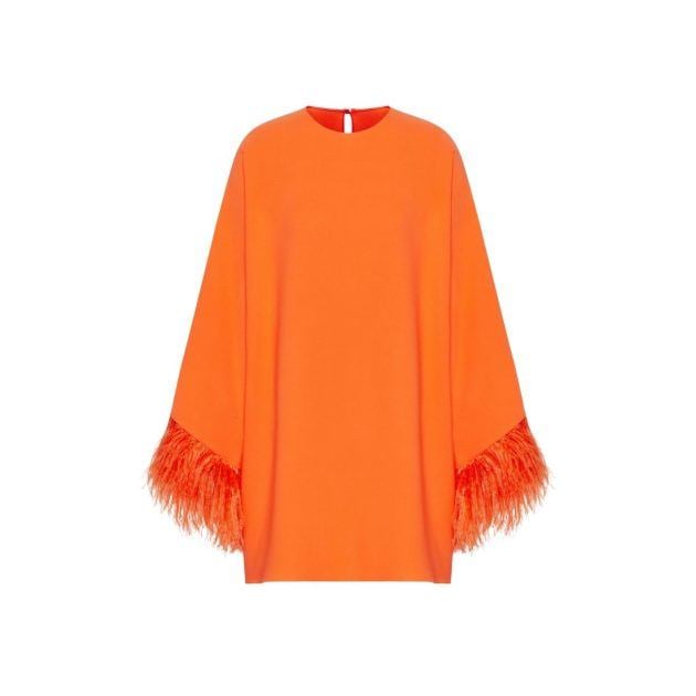 Orange caftan with feather trim on the sleeves
