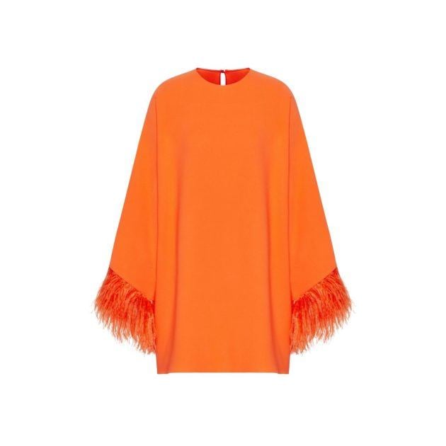 Orange caftan with feather trim on the sleeves