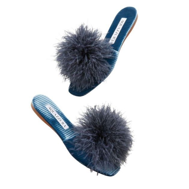 blue flat sandals with feather detailing on the toe