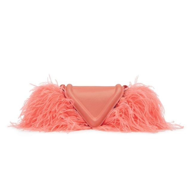 Peach colored clutch bag with feather lining