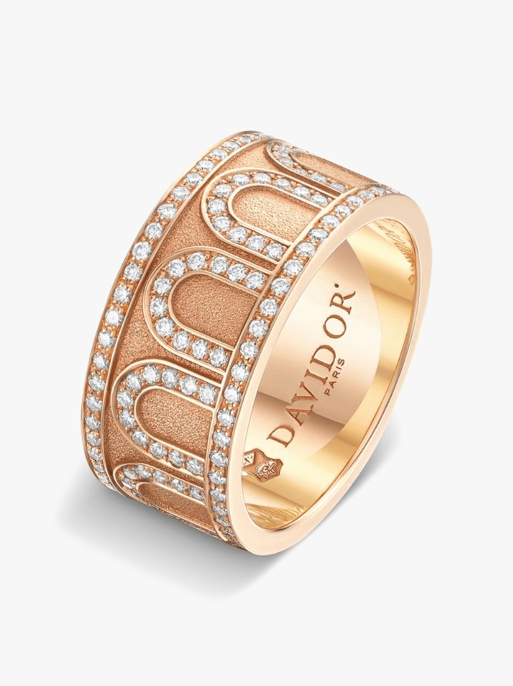 Is she constantly complaining that her golf ball–sized engagement ring is always getting in the way? Allow Davidor’s L’arc de Davidor 18k rose gold ring with palais diamonds to stand in as an eye-catching substitution.