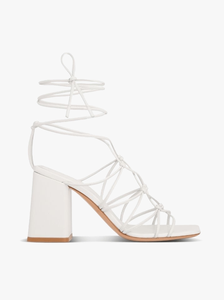 Don’t worry—they literally go with everything. Gianvito Rossi’s Minas ankle-wrap sandals in white not only match anything from jeans to sundresses, they give just the right amount of lift (3.25 inches) without killing her feet.