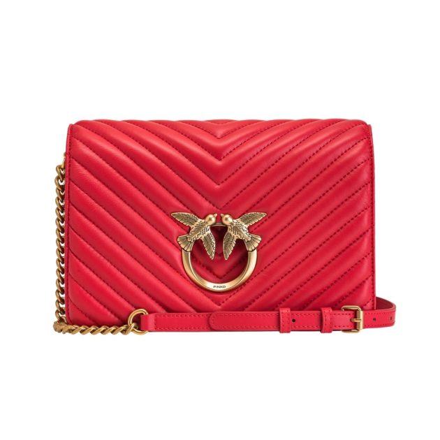 red leather bag with gold hardware and crossbody chain