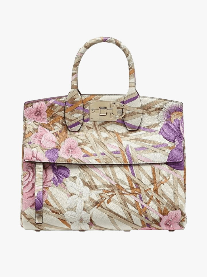 She probably doesn’t need another black handbag. Okay, maybe she does need another black handbag, but she could also probably use something with a little more impact, and the Ferragamo Studio bag in the floral foulard print adds the perfect punch.