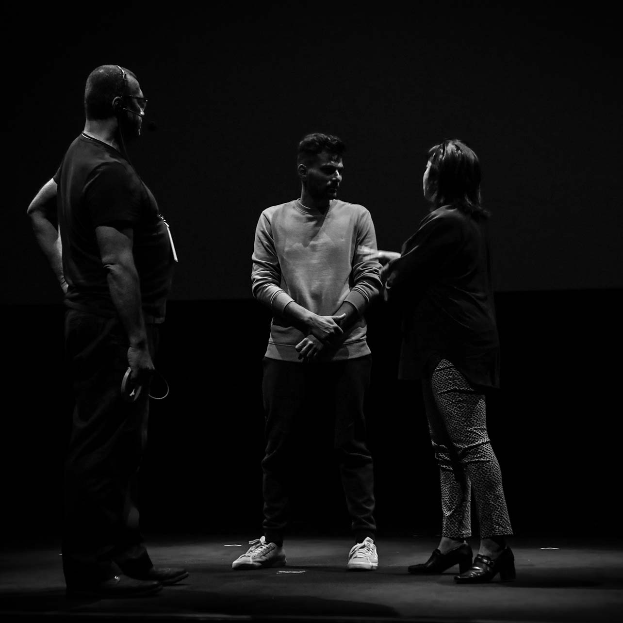 Jay shetty on stage with two other people