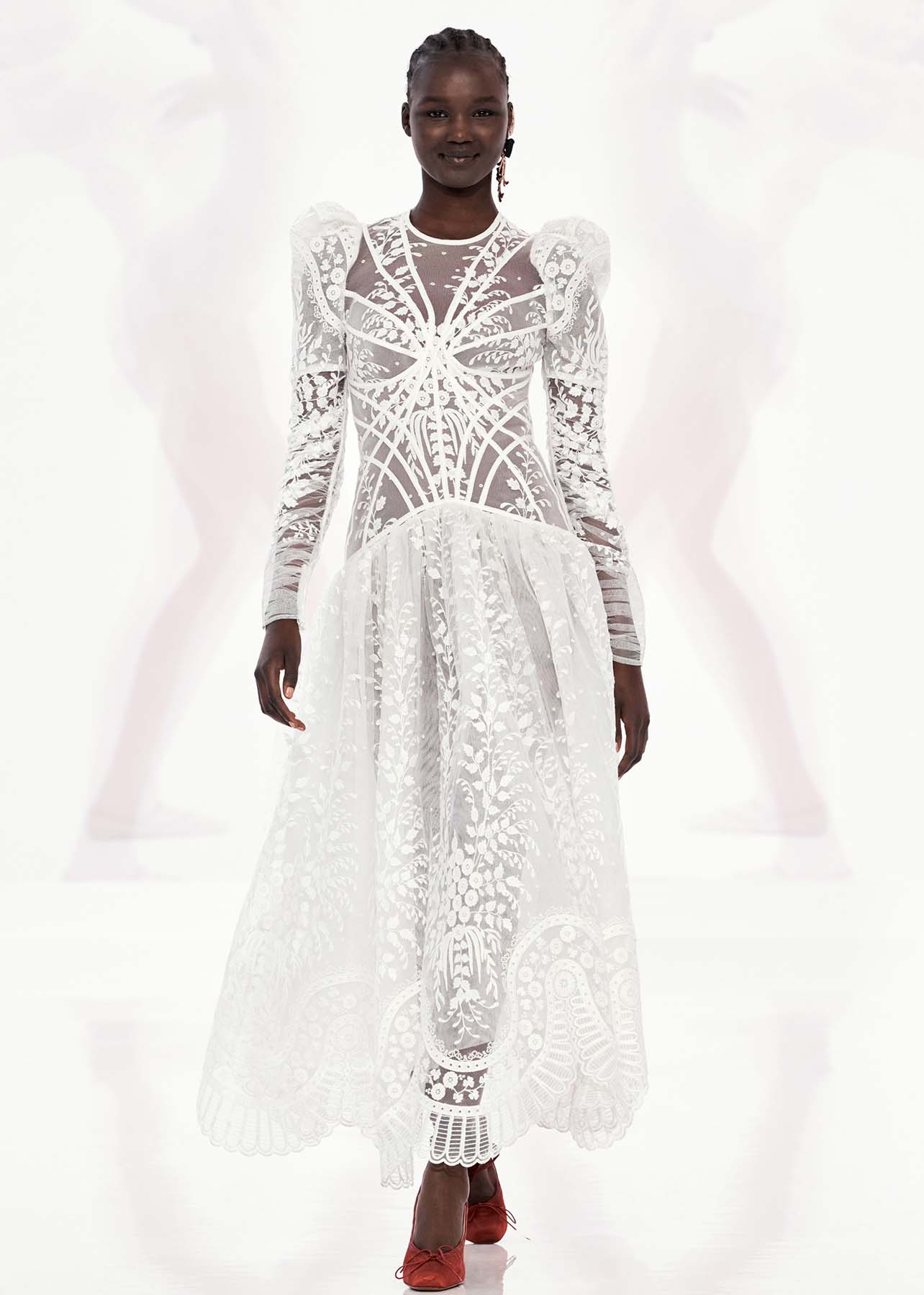 White lace floor length dress photographed on a model