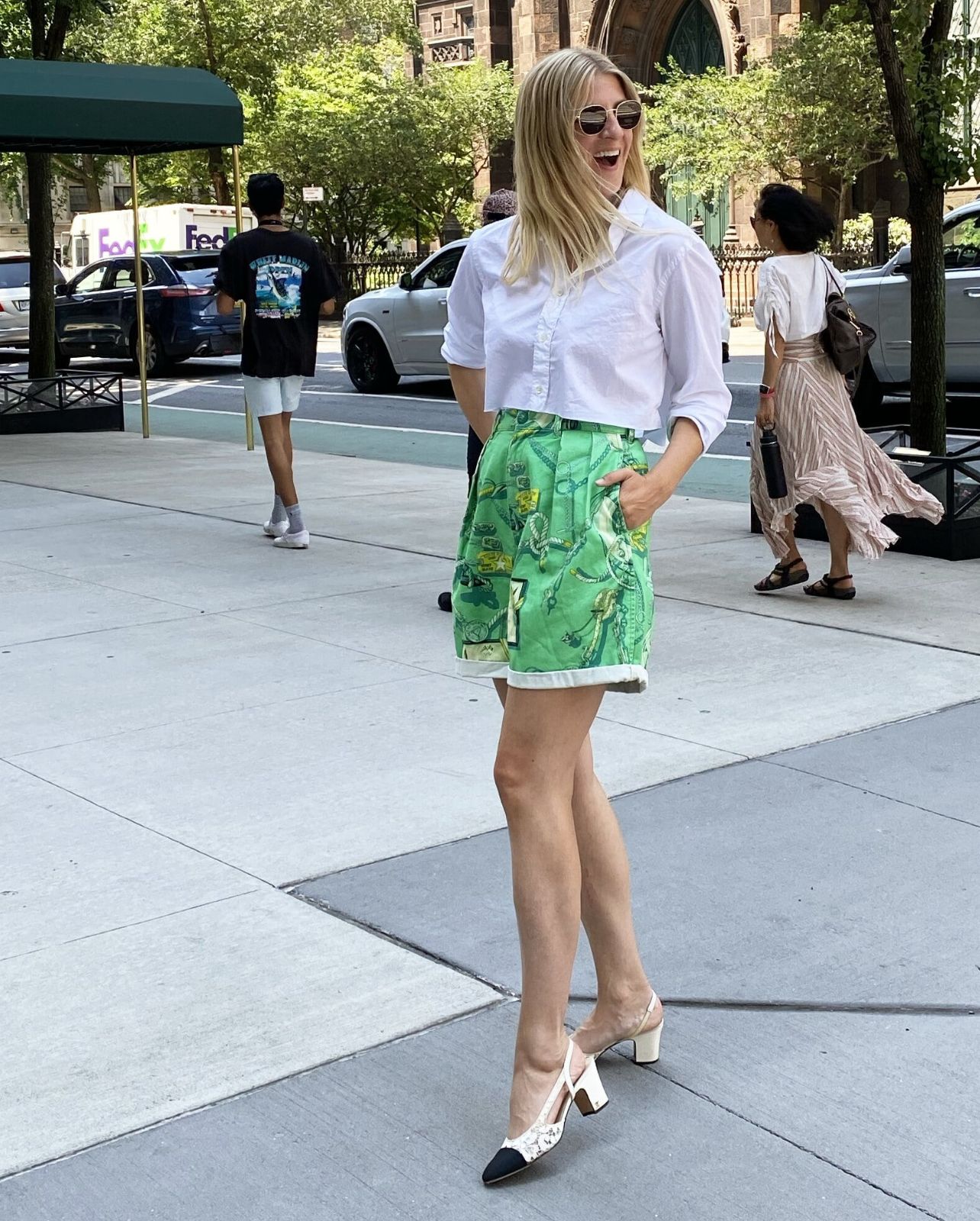 Woman poses for a photo on a street in New York City