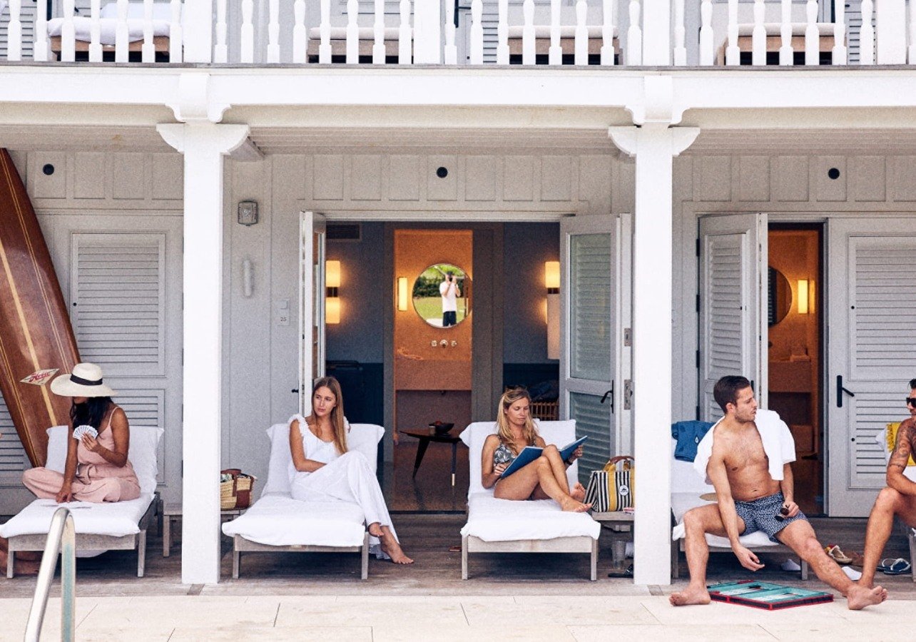 Family enjoying The Surf Club poolside