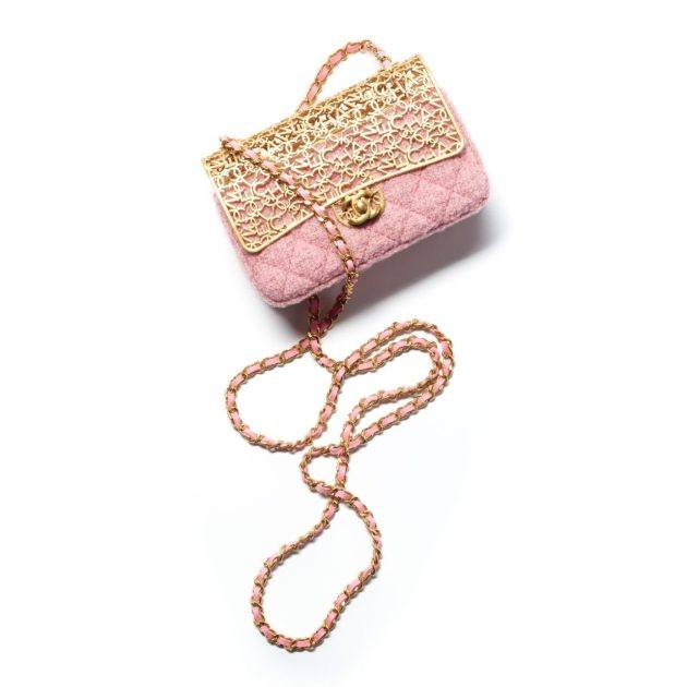 pink quilted bag with gold hardware