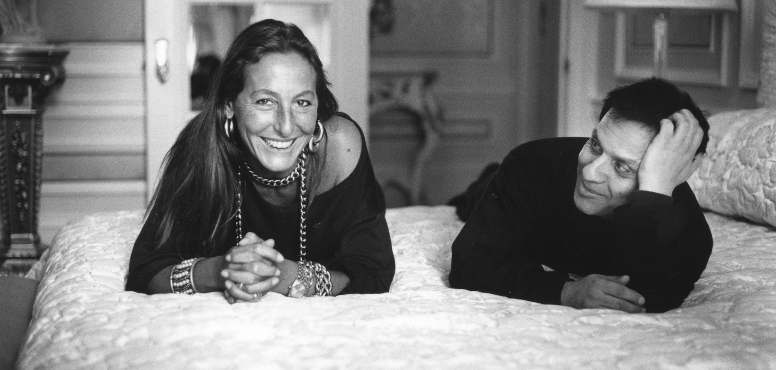 Carlyne Cerf de Dudzeele and Azzedine Alaïa laying on a bed