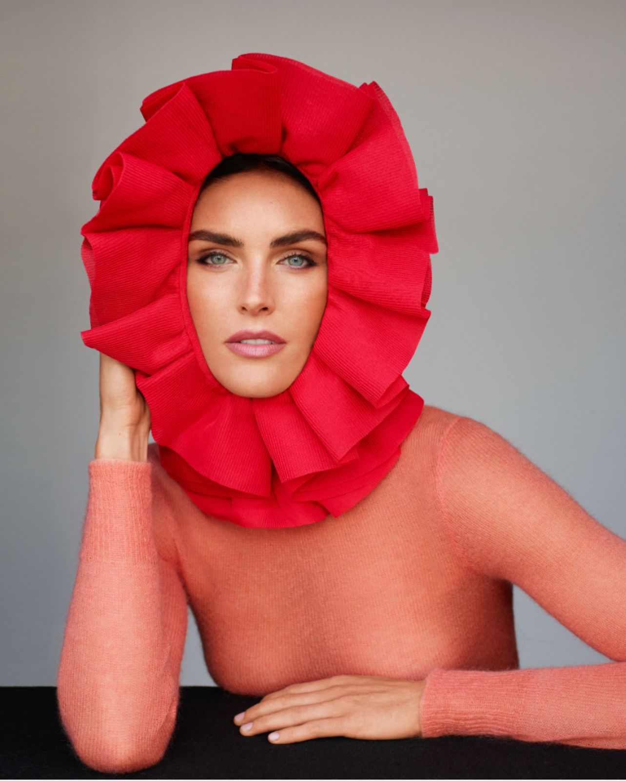 Model wears a floral head piece