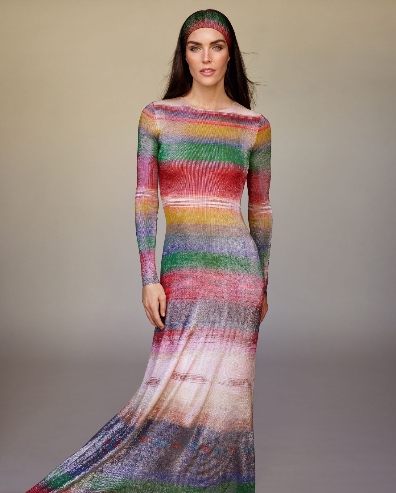 Model poses in a multicolored long sleeve maxi dress