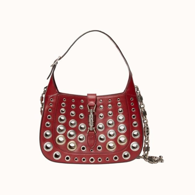 Burgundy leather shoulder bag with medal detailing