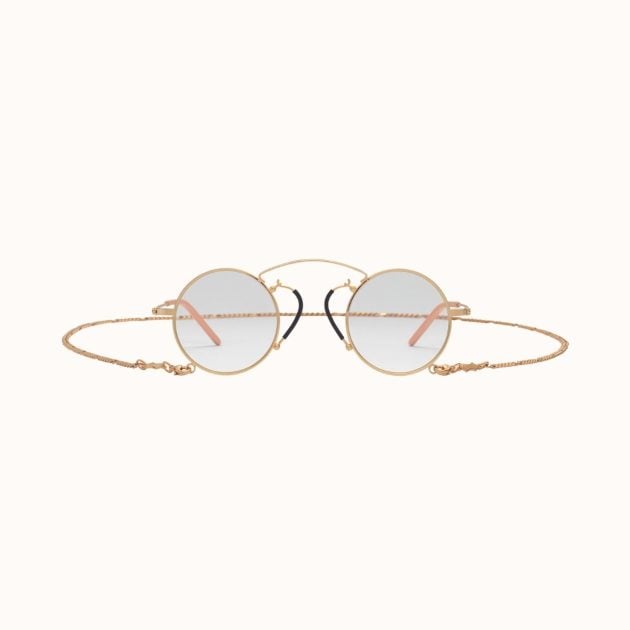 Gold framed glasses with light lenses and gold chain